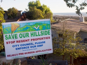 "Save Our Hillside" signs line the neighborhood on Hillcrest Drive, situated just below the proposed development.